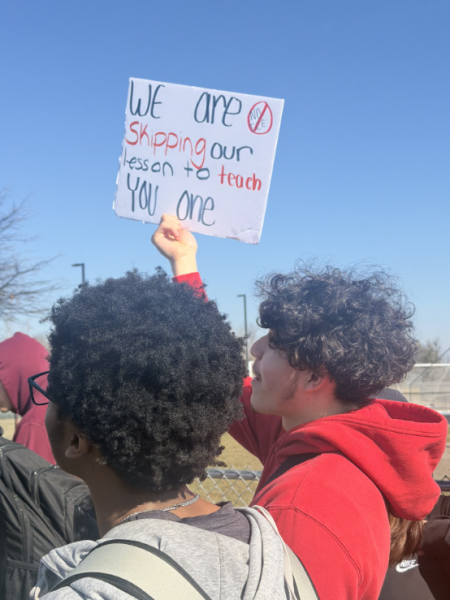 A student (right) holds up a sign that states, "WE are SKIPPING out lesson to teach YOU one"